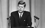 President John F. Kennedy opens at a Washington news conference on Sept. 13, 1962, with a lengthy statement on the Cuban situation. The president decl