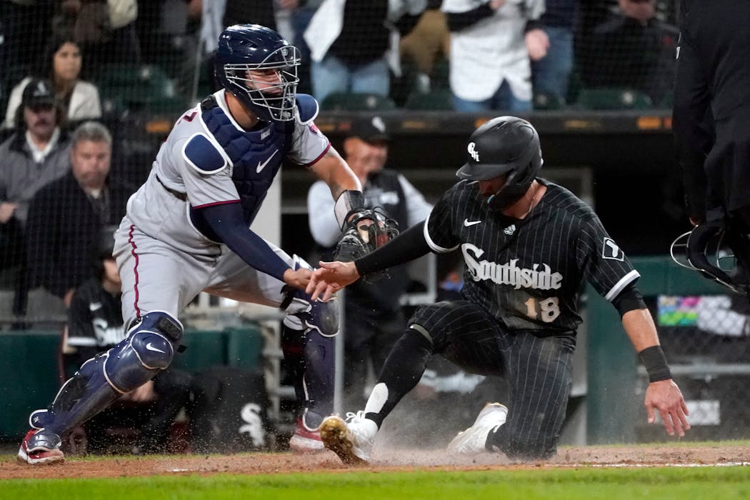 The White Sox’s AJ Pollock slid home in front of Twins catcher Gary Sanchez with the go-ahead run in the seventh inning of Chicago’s 3-2 victory Monday.