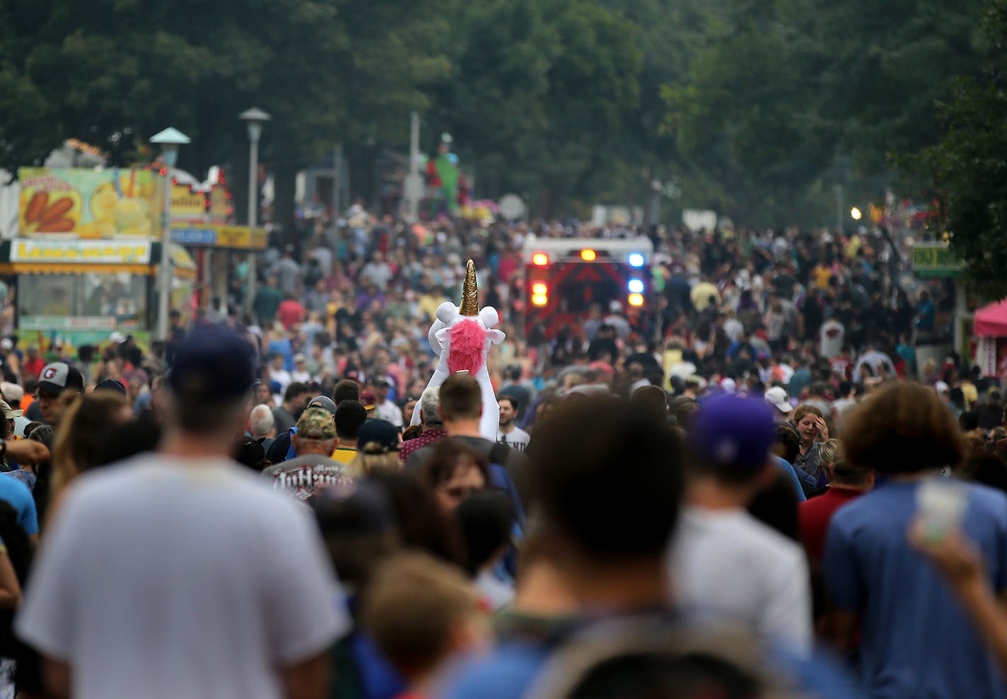 Labor Day's attendance may not have rivaled this past Saturdays but Judson Avenue was clogged enough to slow down Jose Perez of St. Paul, who carried a stuffed unicorn on his shoulders, as well as an emergency vehicle trying to transport a patient during the last day of the Minnesota State Fair Monday, May, Sept. 3, 3018, in Falcon Heights, MN.] DAVID JOLES &#x2022; david.joles@startribune.com Last day of the Minnesota State Fair** Jose Perez,cq