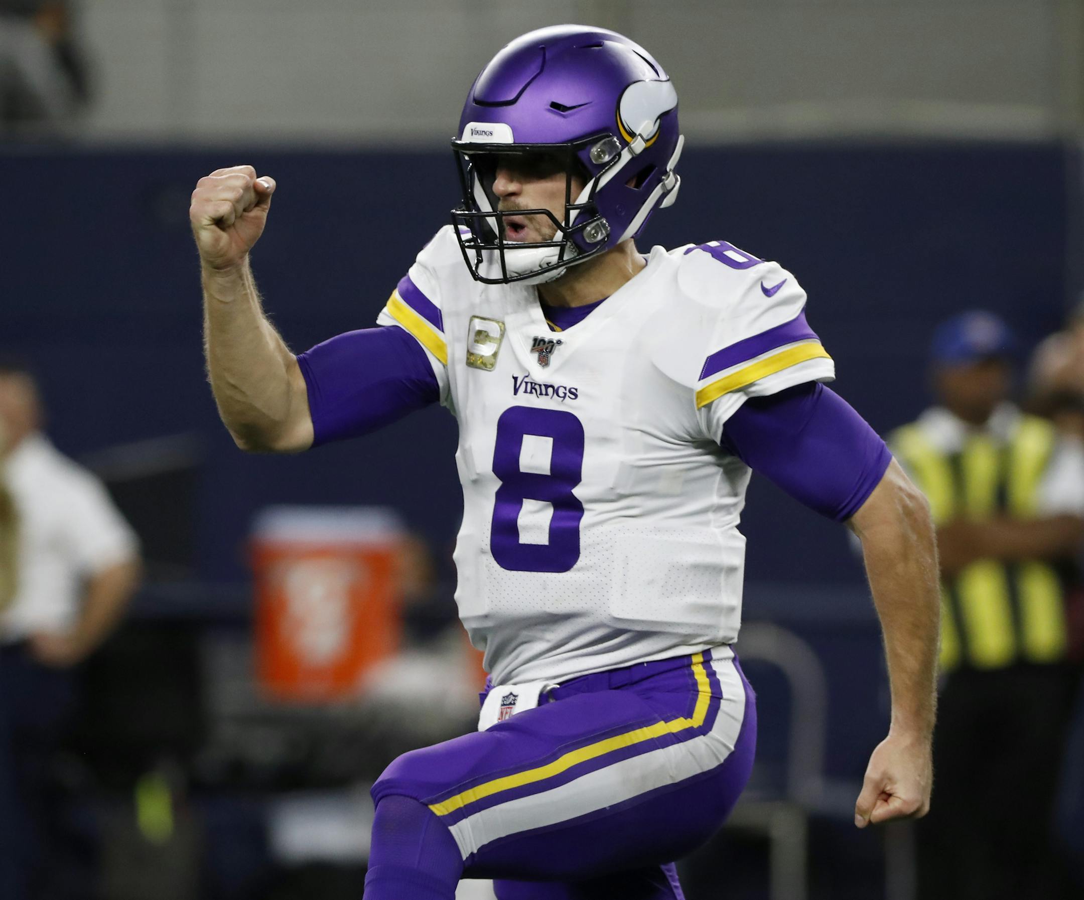 Minnesota Vikings' Kirk Cousins celebrates during an NFL football game against the Dallas Cowboys in Arlington, Texas, Sunday, Nov. 10, 2019. (AP Photo/Roger Steinman)