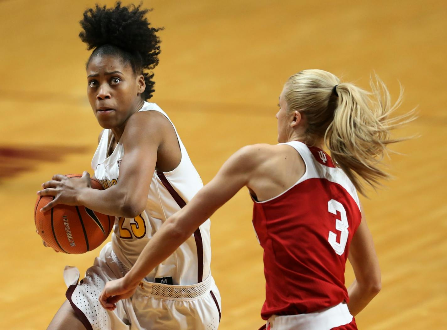 Minnesota Golden Gophers guard Kenisha Bell (23) drove to the basket against Indiana.