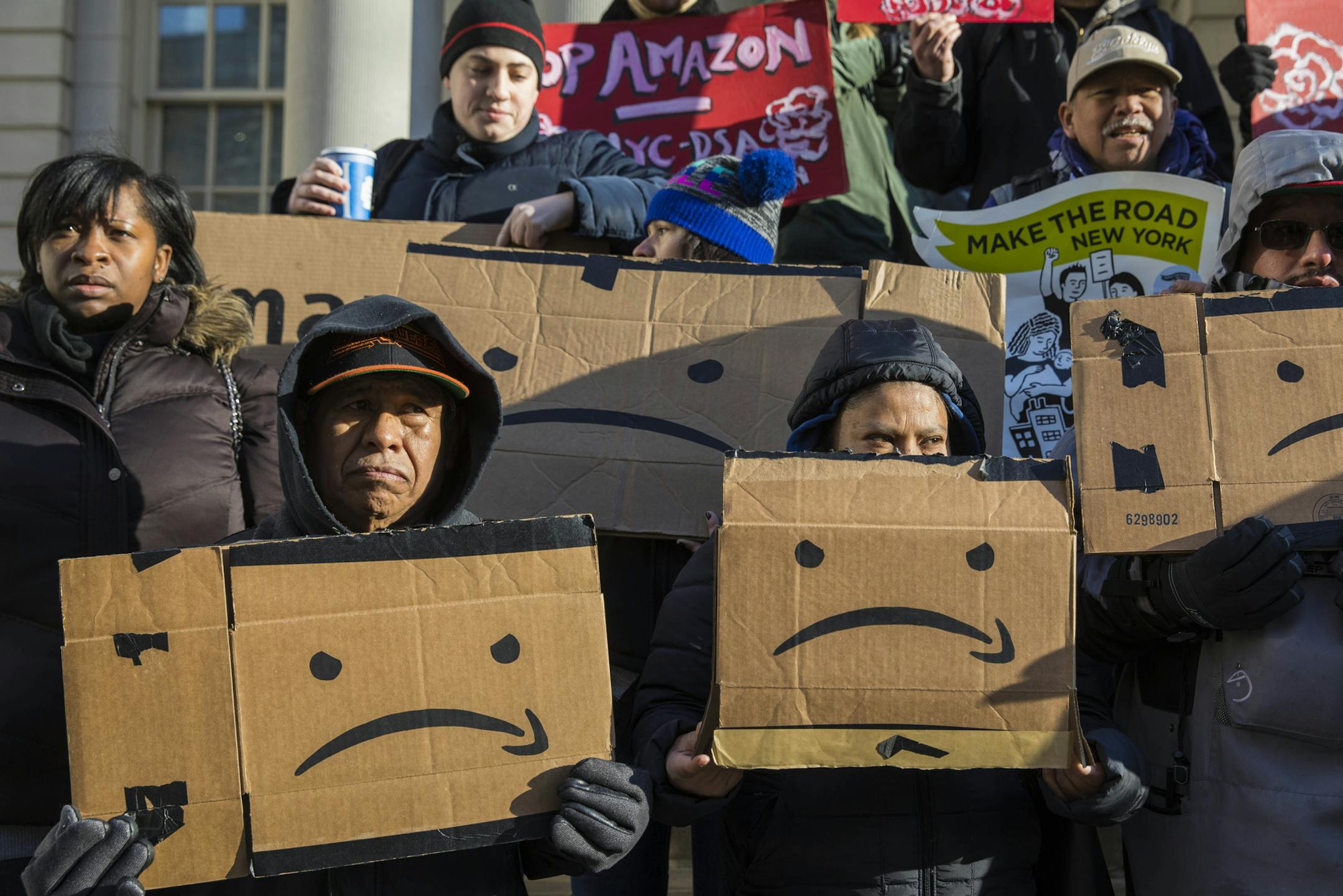 FILE -- Protesters opposed to Amazon's proposed New York campus on the steps of City Hall in New York, Jan. 30, 219. Amazon said on Feb. 14, that it was canceling plans to build its corporate campus in New York. The deal had run into fierce opposition from local lawmakers who criticized providing subsidies to one of the world’s richest companies. Amazon said the deal would have created more than 25,000 jobs. (Hiroko Masuike/The New York Times)