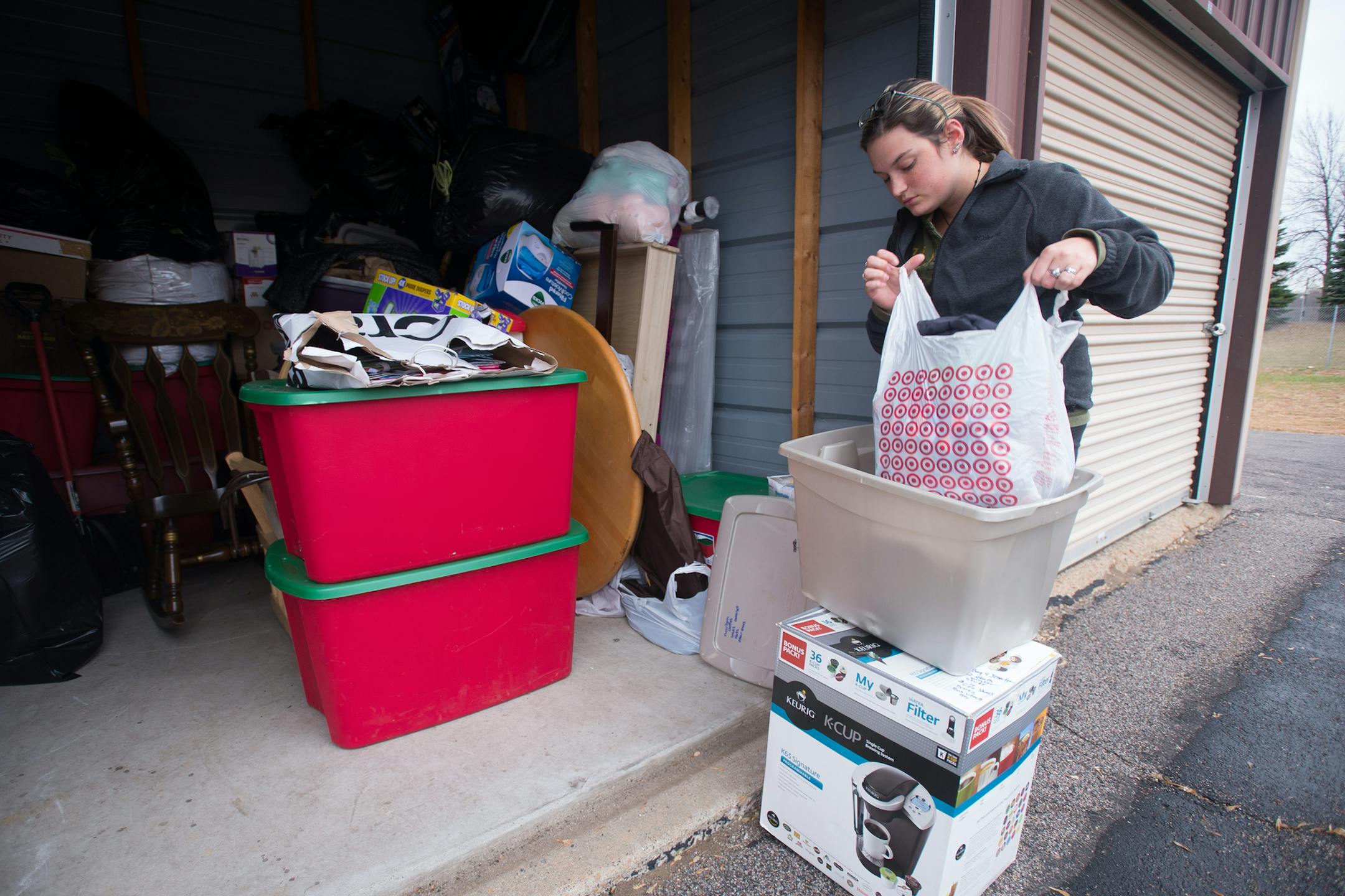 Brie Pothier (cq), of Chaska, searches through her belongings for a Halloween costume for her 9-month-old son Thursday morning at Twin Cities Self Storage. Pothier has been using the storage facility for about two years, mostly for odds and ends around her house. ] AARON LAVINSKY &#x2022; aaron.lavinsky@startribune.com Mini-storage operations continue to pop up across the Twin Cities landscape, fueled by people's propensity to accumulate more possessions than can fit into their homes. Bruce Lamo