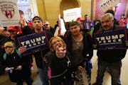 Supporters of President Donald Trump and anti-Trump protesters clashed in the hallway outside the rotunda at a national March4Trump Saturday, March 4,