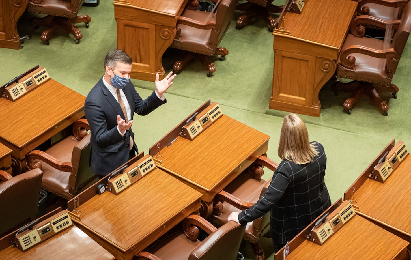 Democratic leaders House Majority Leader Ryan Winkler, DFL-Golden Valley and House Speaker Melissa Hortman, DFL-Brooklyn Park talked on the House floor in October before the start of the fifth special session of the year.