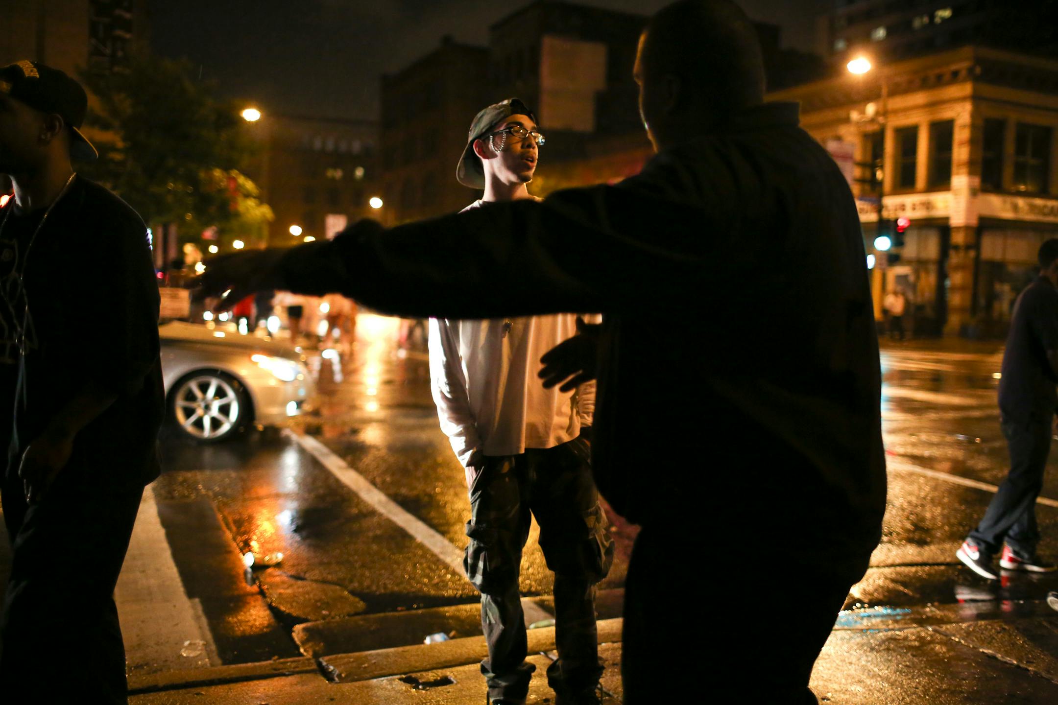 In this file photo taken outside Club Envy, a security guard encouraged club-goers to disperse shortly after 2 a.m. Monday morning, May 28, 2012.