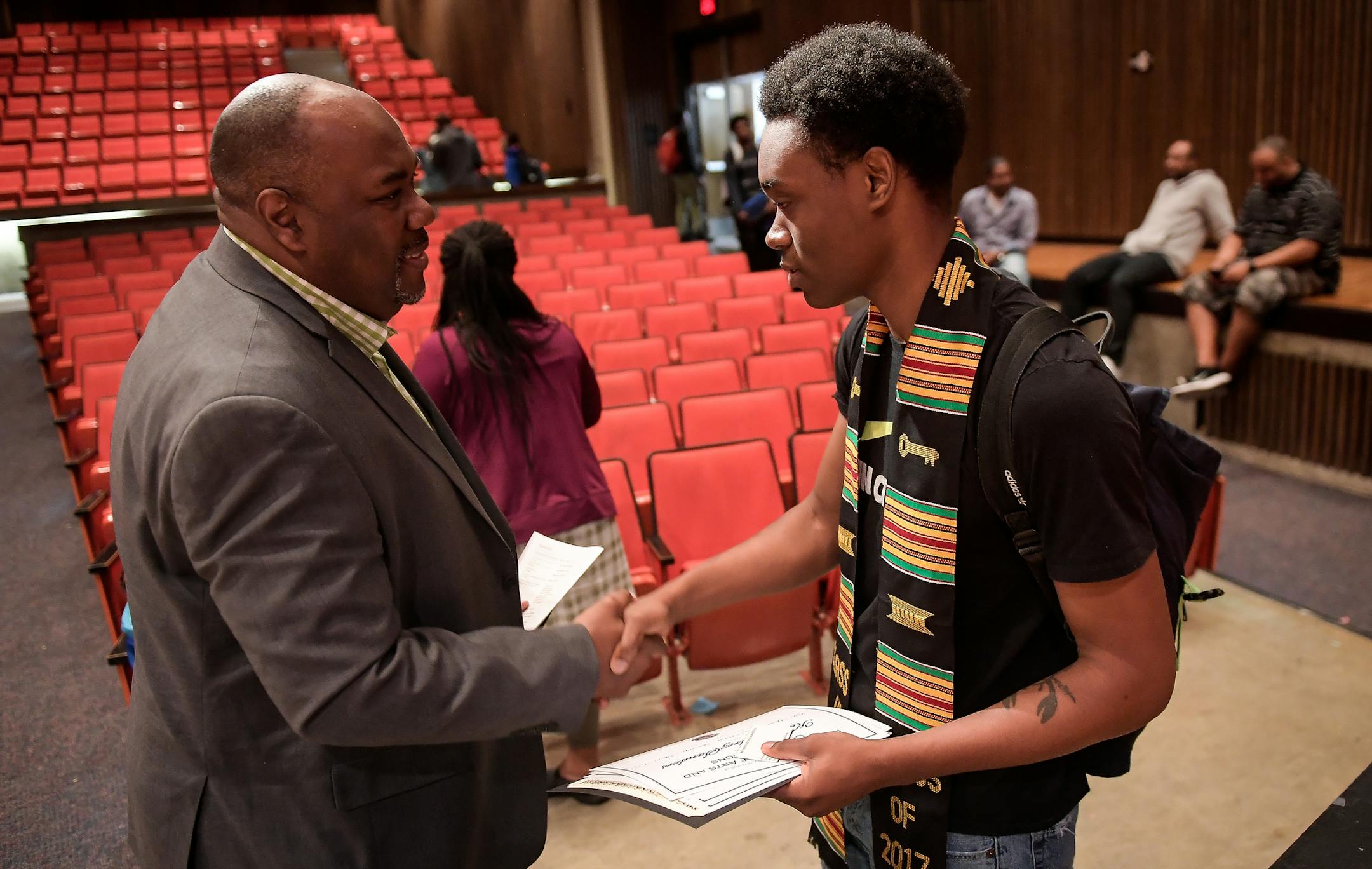 Ke-Mondrez Sanders, right, shook hands with Carlos Sneed, with the Alpha Phi Alpha fraternity, after North High School's senior awards day ceremony. Sanders was one of the top students in his class, and was awarded the Alpha Phi Alpha Raymond W. Cannon Award as well as numerous other honors. ] AARON LAVINSKY ï aaron.lavinsky@startribune.com Minneapolis North High nearly closed a few years ago, plagued with slipping enrollment and tanking academics. Now, it's in comeback mode, with rising en