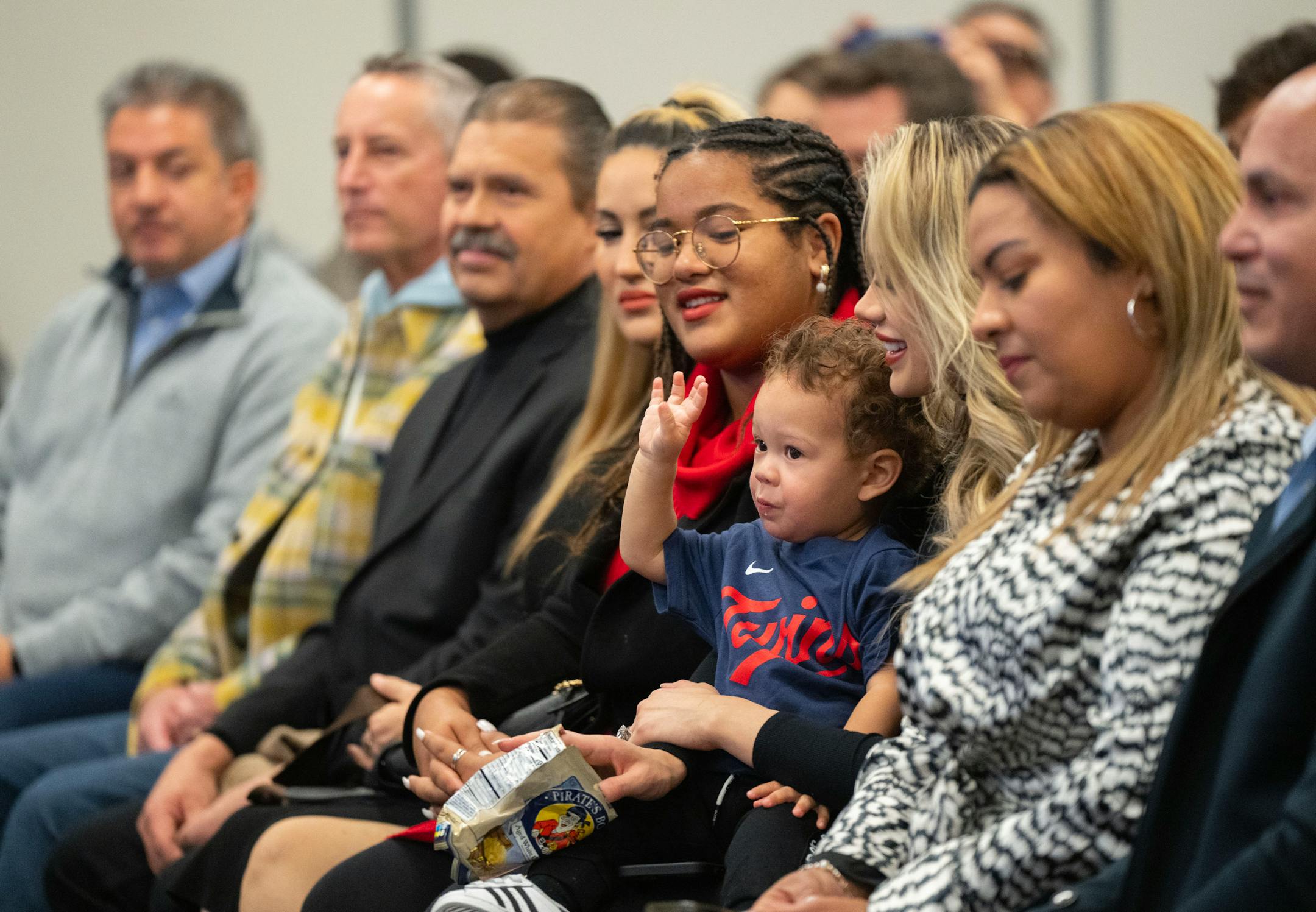 Kylo Correa, 1, waves to his father, Carlos, as he takes the stage for a press conference to announce Correa's re-signing.