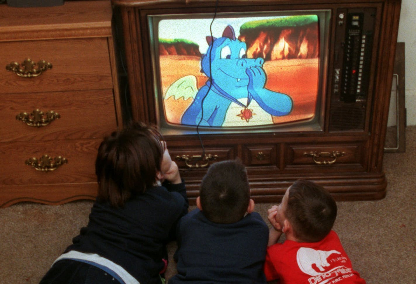 St. Paul, MN - Albanians Nazim Saliu and his family relocated to the Twin Cites from Kosovo, when they were forced to leave their native country during the ethnic cleansing campaign by the Serbs. Now living in St. Paul, the family is adjusting well. -- Three of the Saliu children are mesmerized by a cartoon on television on a winter afternoon. Although the youngsters don�t know much English yet, they�re learning quickly, both in school and from watching children�s television shows. The televisio