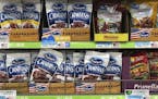 Imported raisins and nuts from the United States are displayed on sale at a supermarket in Beijing, Monday, April 2, 2018. China raised import duties 