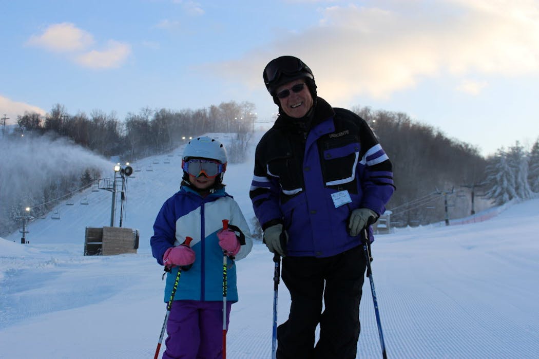 Leigh Nelson, right, skis Welch Village with his great-granddaughter, Carmyn in 2014. 