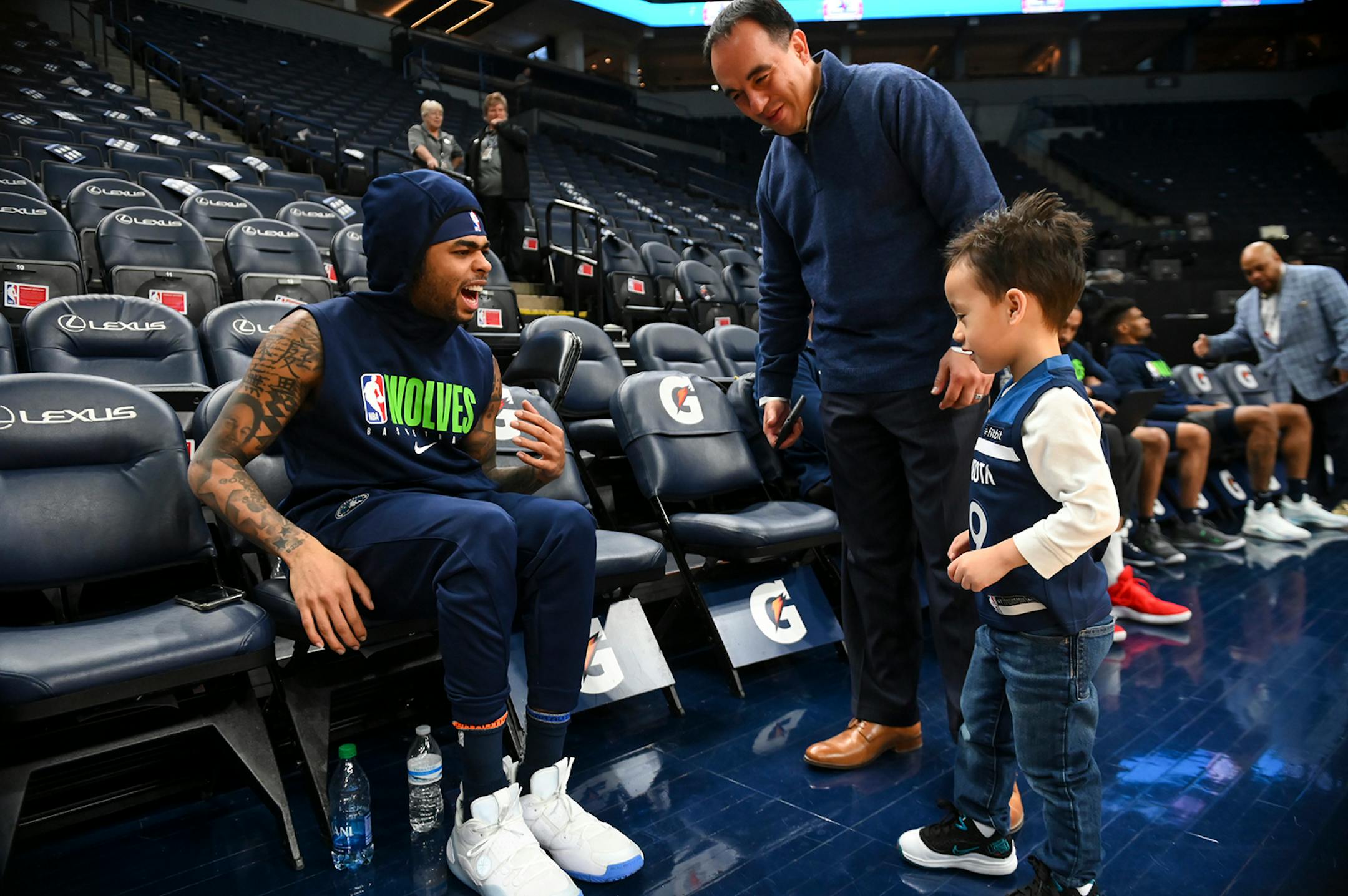 Minnesota Timberwolves guard D'Angelo Russell (0) faked pain after Grayson Rosas, 4, son of Timberwolves President of Basketball Operations Gerrson Rosas, high fived Russell before Saturday night's game.