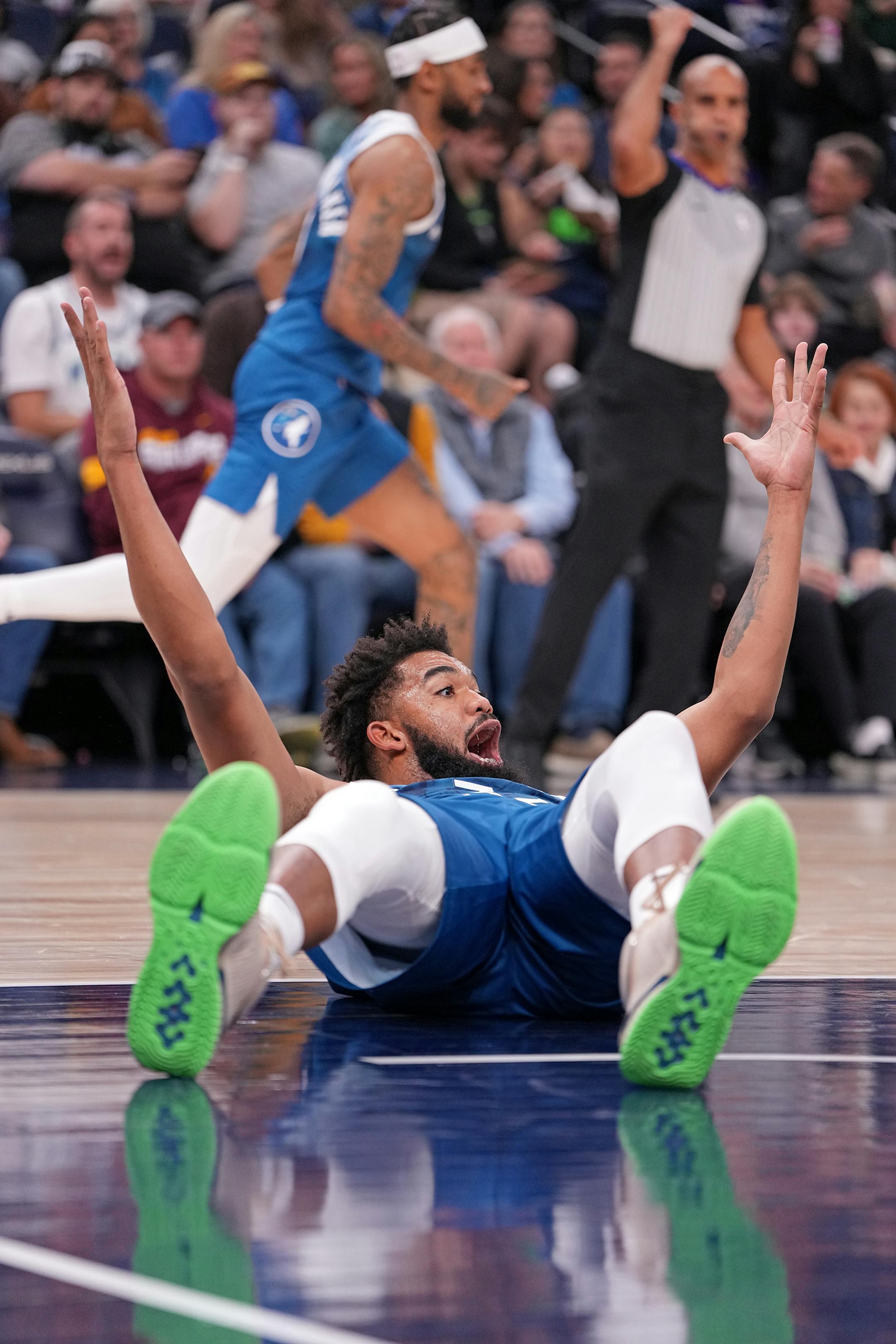 Minnesota Timberwolves center Karl-Anthony Towns (32) yells after he is fouled during the second half of the game.