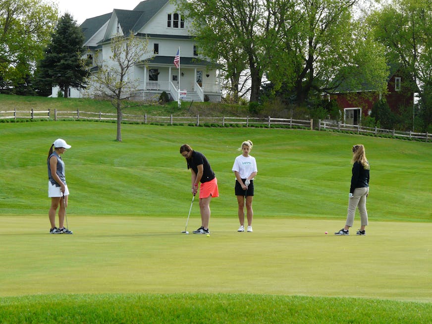 New Life High School girls' golf team members at Woodbury's Eagle Valley golf course. Photo by Dave Peterson