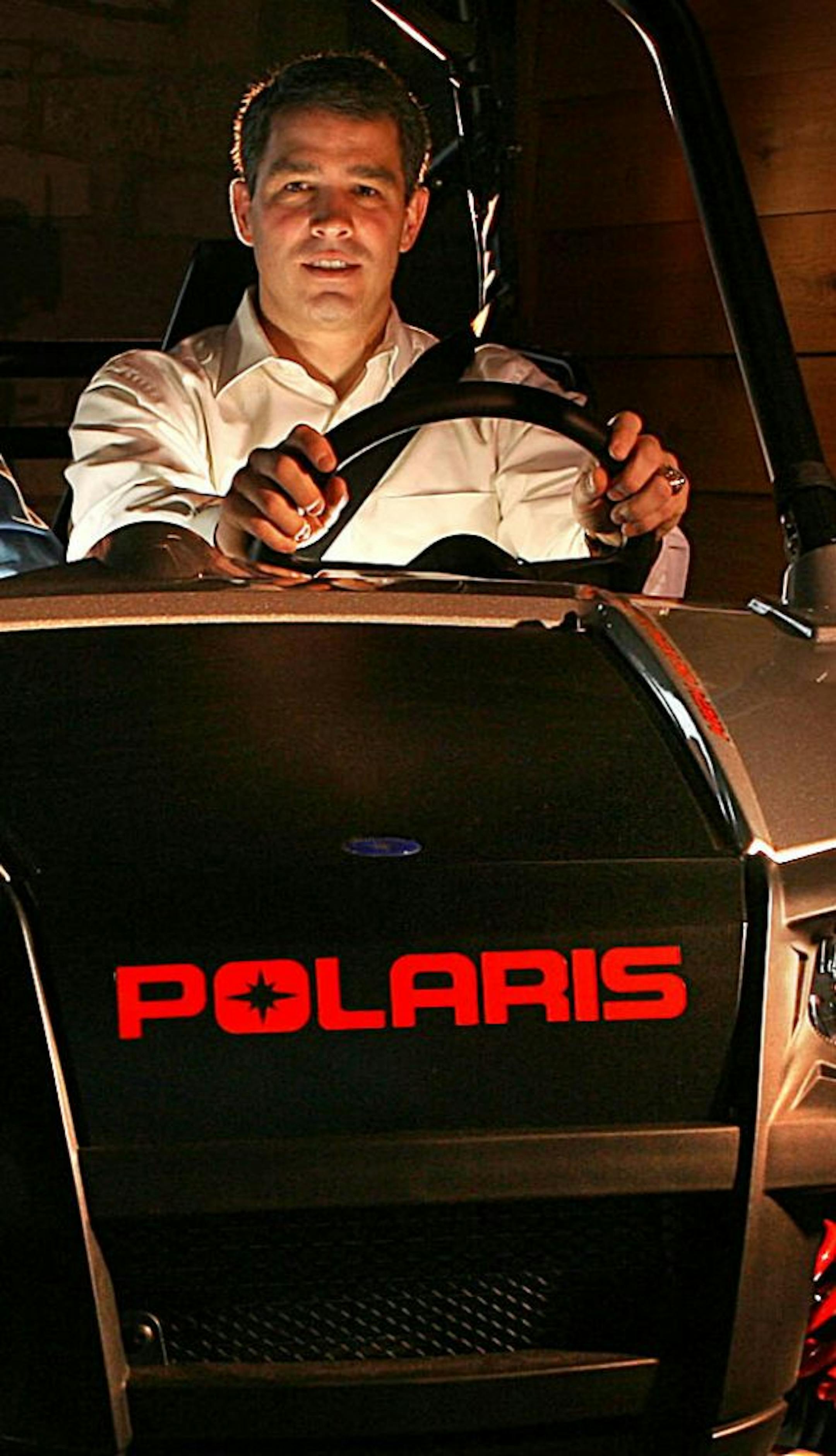 Polaris Industries Inc. CEO Scott Wine photographed in a 2009 Polaris Ranger, a Class II ATV, on display at the company's headquarters in Medina.