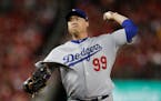 Los Angeles Dodgers starting pitcher Hyun-Jin Ryu throws to a Washington Nationals batter during the first inning in Game 3 of a baseball National Lea