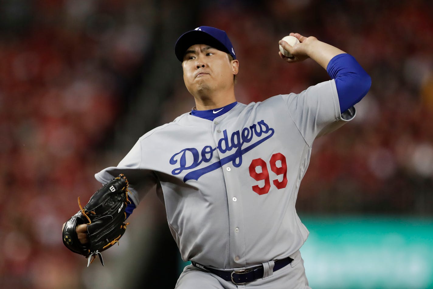 Los Angeles Dodgers starting pitcher Hyun-Jin Ryu throws to a Washington Nationals batter during the first inning in Game 3 of a baseball National League Division Series on Sunday, Oct. 6, 2019, in Washington. (AP Photo/Julio Cortez)