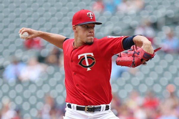 Minnesota Twins pitcher Jose Berrios throws against the Texas Rangers in the first inning of a baseball game Sunday, June 24, 2018, in Minneapolis.