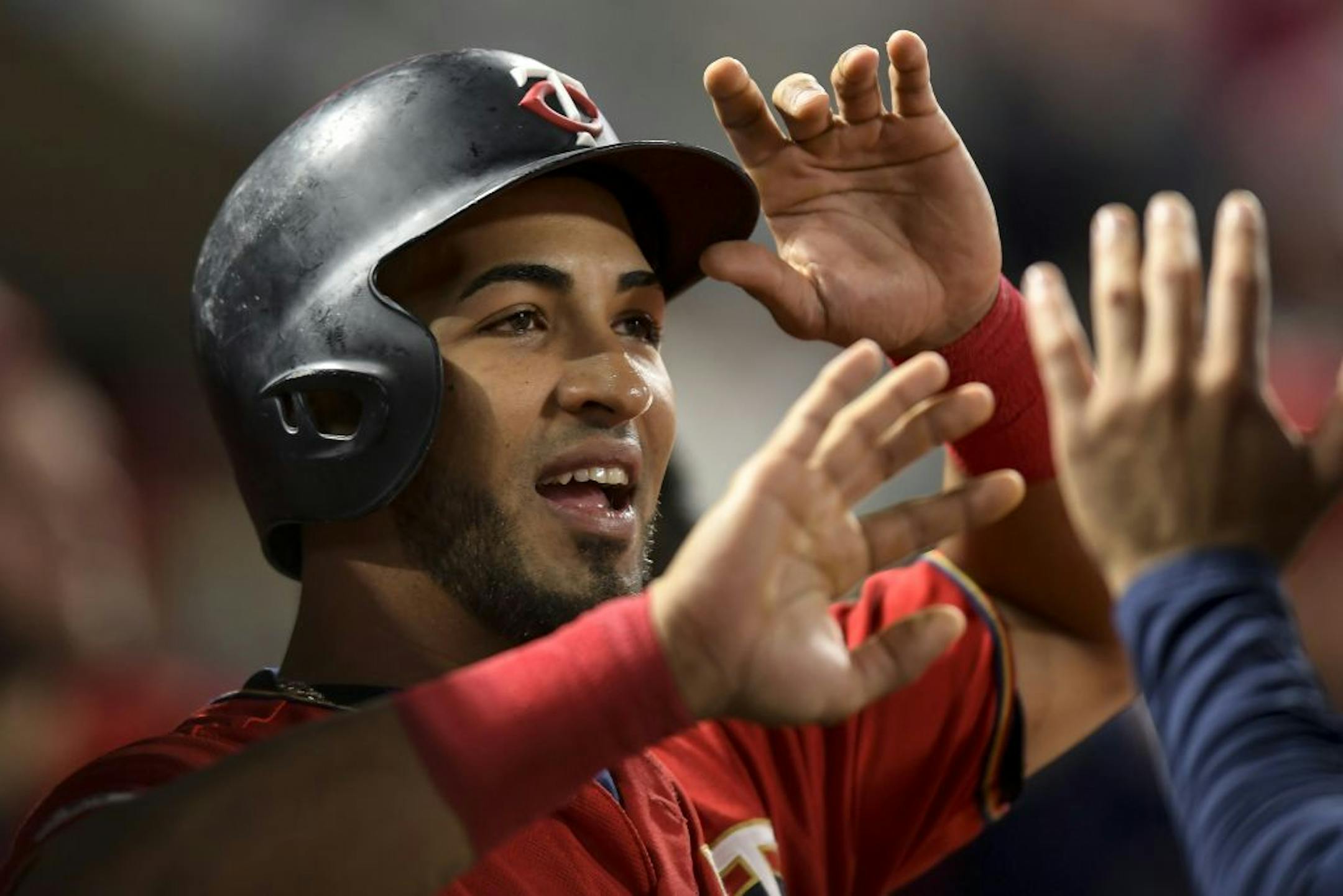 Minnesota Twins left fielder Eddie Rosario (20) celebrated after scoring a run off a double hit by third baseman Miguel Sano (22) in the bottom of the fifth inning against the Kansas City Royals.