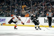 Los Angeles Kings left wing Kevin Fiala, right, takes the puck as Anaheim Ducks right wing Jakob Silfverberg reaches for him during the second period 