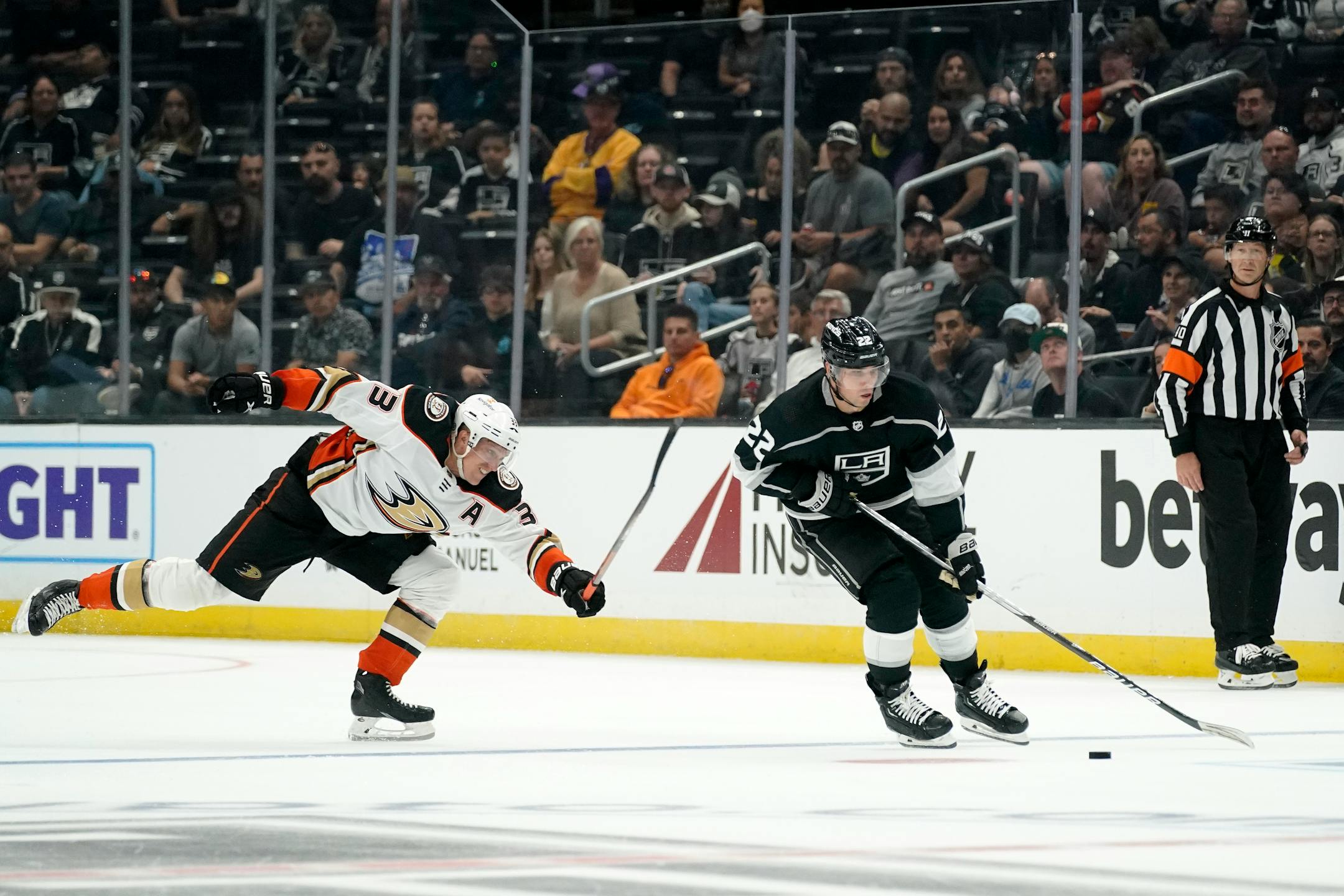 Los Angeles Kings left wing Kevin Fiala, right, takes the puck as Anaheim Ducks right wing Jakob Silfverberg reaches for him during the second period of a preseason NHL hockey game Saturday, Oct. 8, 2022, in Los Angeles. (AP Photo/Mark J. Terrill)