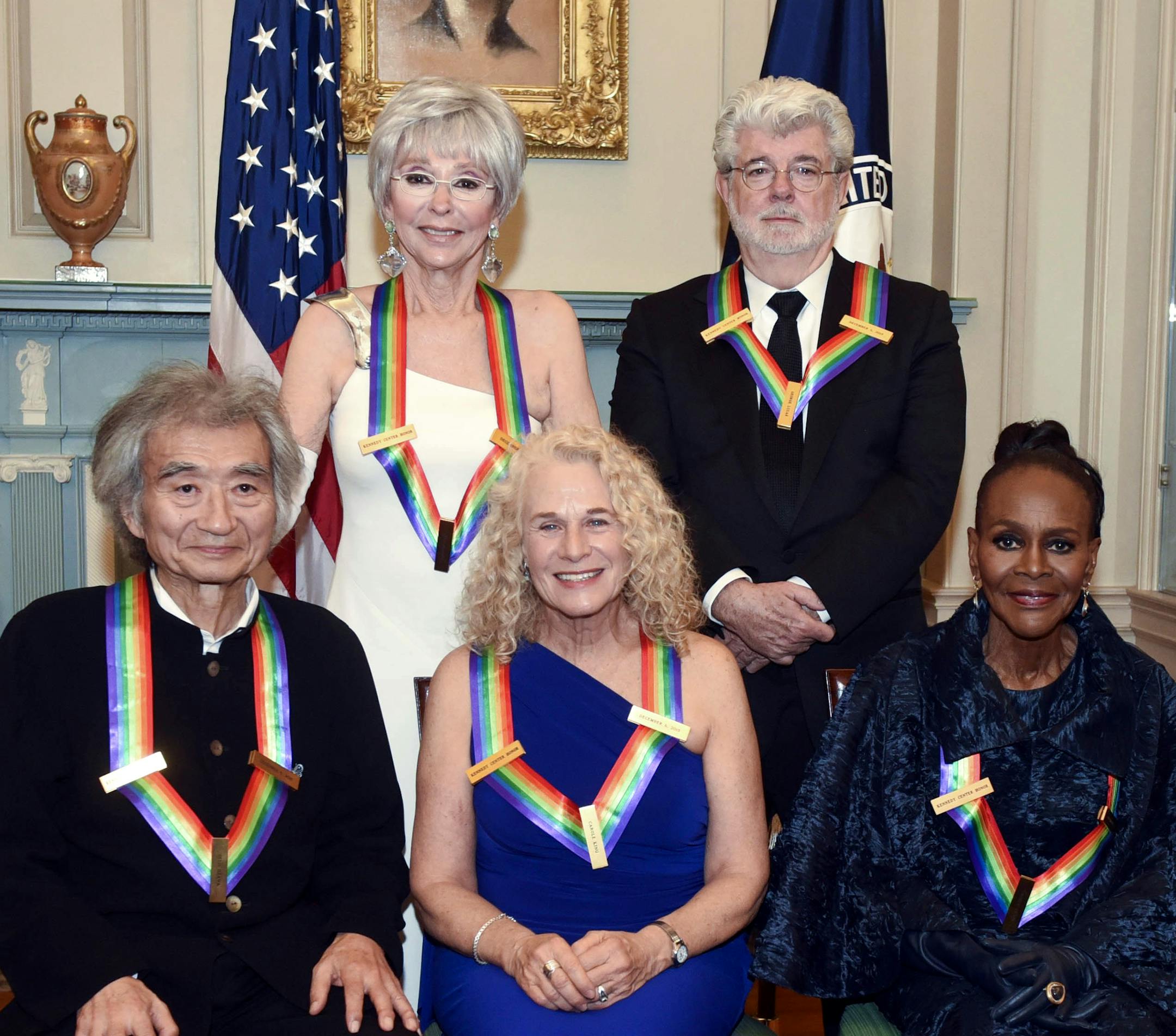 The 2015 Kennedy Center Honorees, from left, Seiji Ozawa, Rita Moreno, Carole King, George Lucas and Cicely Tyson pose for a group photo following the State Department Dinner for the Kennedy Center Honors on Saturday, Dec. 5, 2015, in Washington. (AP Photo/Kevin Wolf)