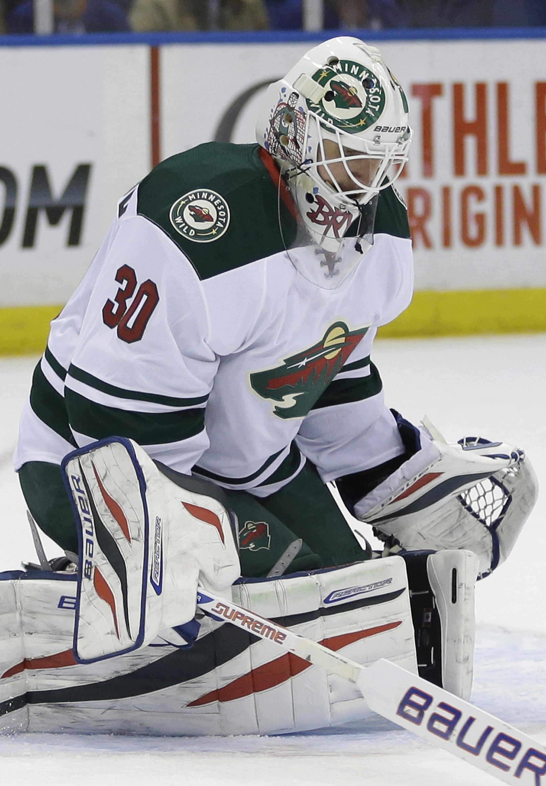 Minnesota Wild goalie Ilya Bryzgalov makes a save during the second period of the NHL hockey game against the New York Islanders, Tuesday, March 18, 2014, in Uniondale, New York. (AP Photo/Seth Wenig)