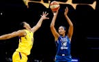 Napheesa Collier shoots while defended by Los Angeles Sparks' Candace Parker in September.