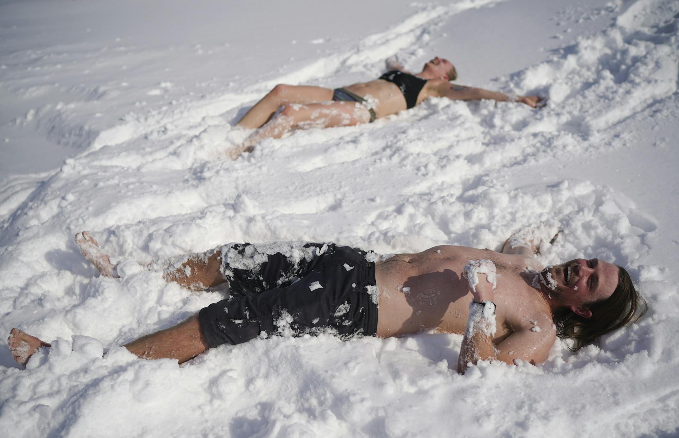 Mark McKee and Ingrid Aune were ready to cool down after baking in the 200 degree heat of Nickolai Koivunen’s MinneSauna on the ice of Lake Harriet as part of the Art Shanty Project Sunday morning. ] JEFF WHEELER • Jeff.Wheeler@startribune.com A storm dumped several inches of snow on the Twin Cities overnight and into Sunday morning, February 9, 2020. At Lake Harriet, the morning crowds at the Art Shanty Project were smaller on the final day of this year's run.