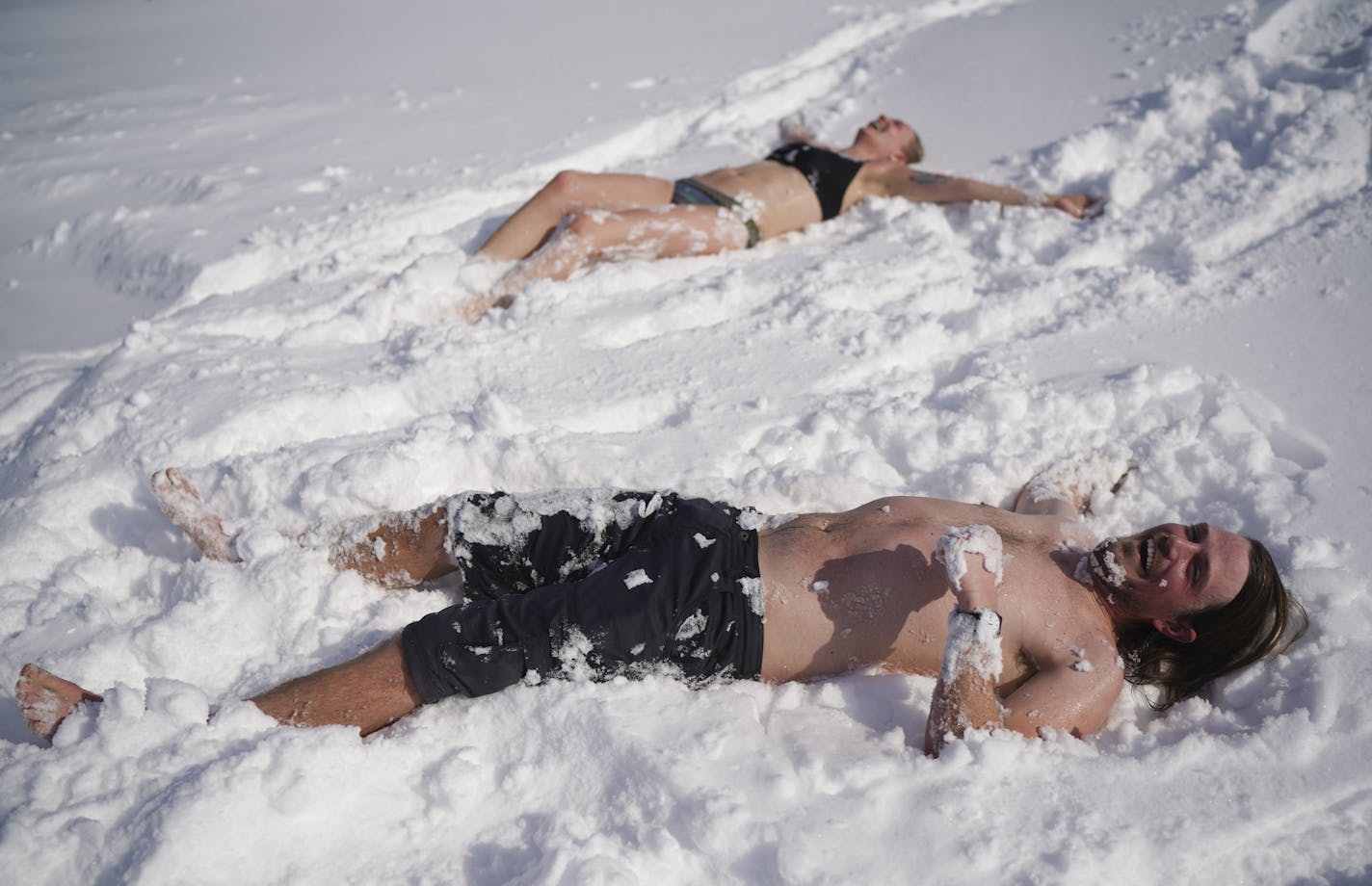 Mark McKee and Ingrid Aune were ready to cool down after baking in the 200 degree heat of Nickolai Koivunen&#x2019;s MinneSauna on the ice of Lake Harriet as part of the Art Shanty Project Sunday morning. ] JEFF WHEELER &#x2022; Jeff.Wheeler@startribune.com A storm dumped several inches of snow on the Twin Cities overnight and into Sunday morning, February 9, 2020. At Lake Harriet, the morning crowds at the Art Shanty Project were smaller on the final day of this year's run.