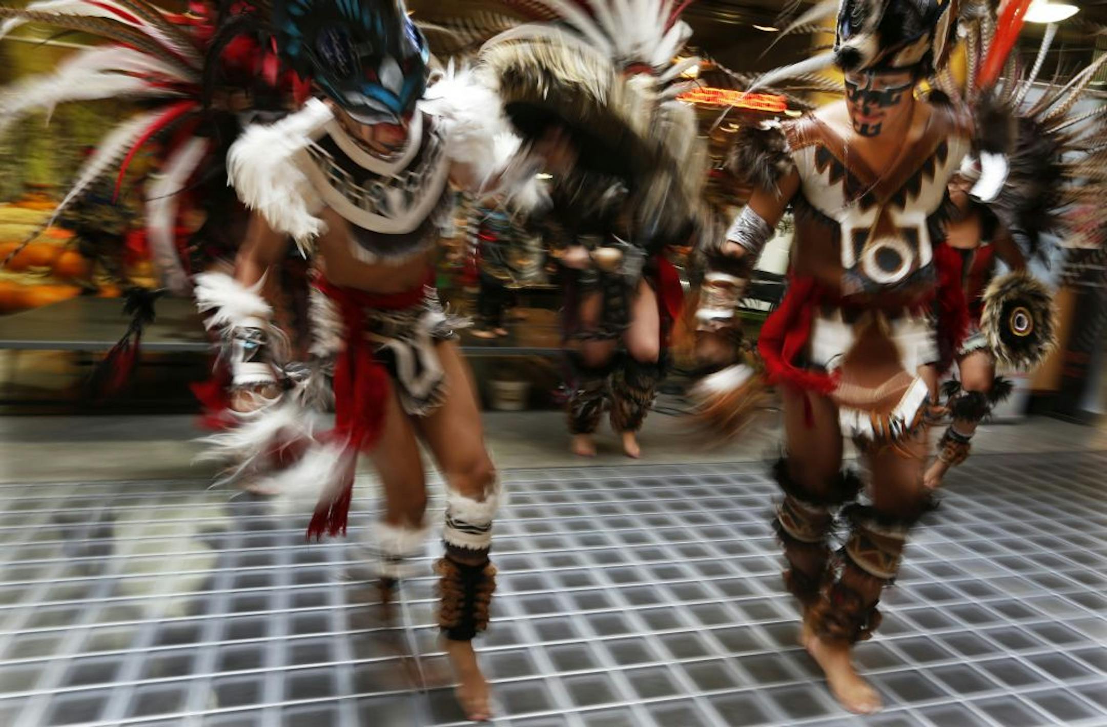 At the Midtown Global Market, Kalpulli KetzalCoatlicue members performed some Aztec dances to celebrate El Dia de Los Muertos, a traditional Mexican holiday whereby the departed are encouraged to come back and visit with the living .