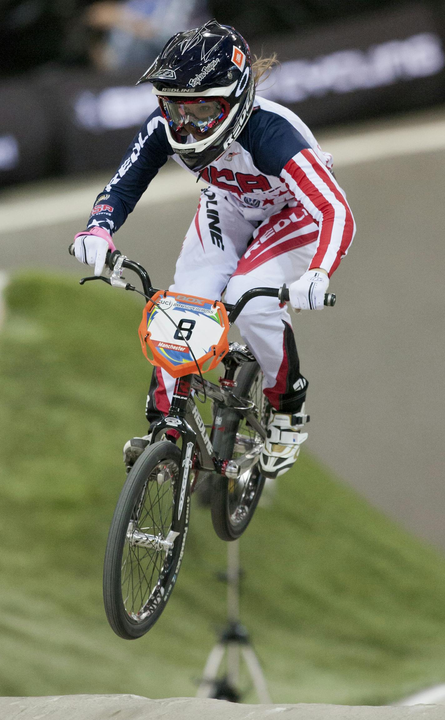 FILE - In this April 19, 2013, file photo, Alise Post, of the United States, rides to second place in the women's elite BMX Supercross World Championships in Manchester, England. Post is a top medal contender at the Olympics in Rio de Janiero . (AP Photo/Jon Super, FIle) ORG XMIT: NY357