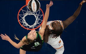 Lynx forward Alanna Smith (8) and Mercury center Murjanatu Musa battle for a rebound in the first quarter at Target Center on Tuesday.