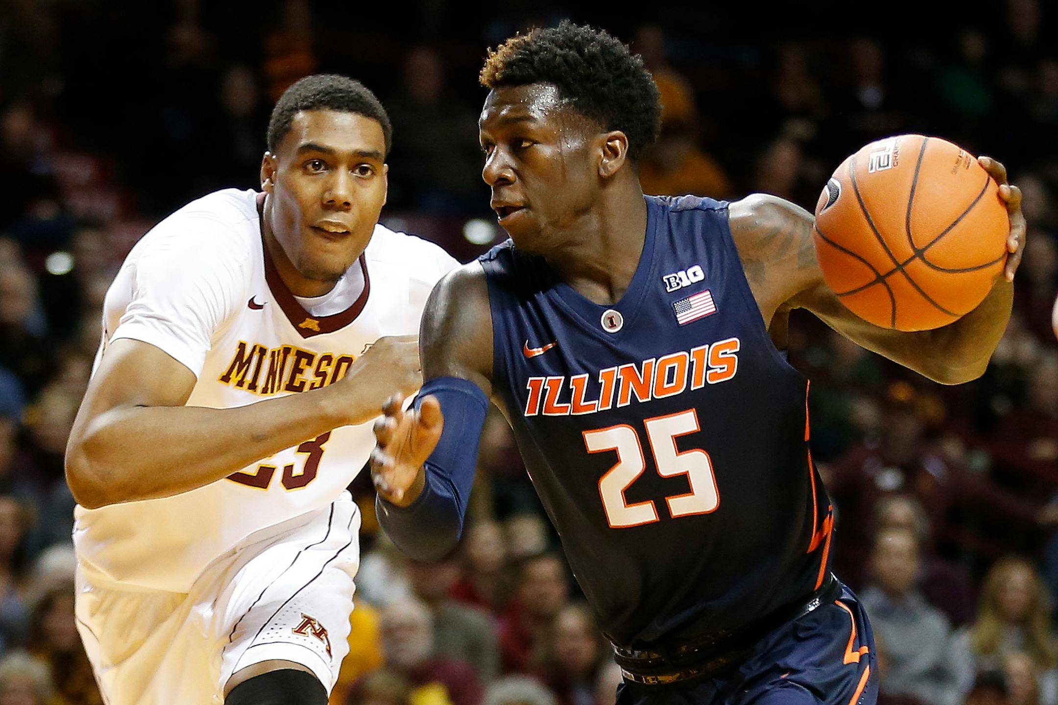 Illinois guard Kendrick Nunn (25) drives the ball around Minnesota forward Charles Buggs (23) in the first half of an NCAA college basketball game Saturday, Jan. 23, 2016 in Minneapolis. (AP Photo/Stacy Bengs)