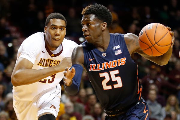 Illinois guard Kendrick Nunn (25) drives the ball around Minnesota forward Charles Buggs (23) in the first half of an NCAA college basketball game Sat
