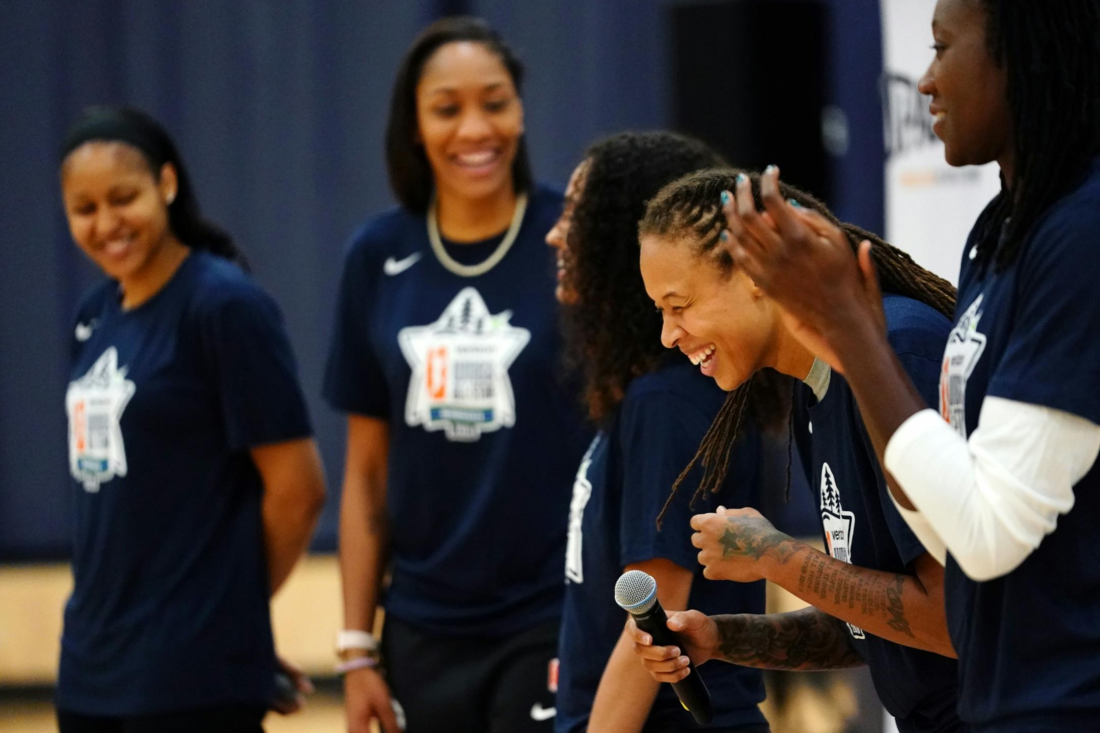 Minnesota Lynx guard Seimone Augustus (33) laughed during introductions at the start of the clinic.