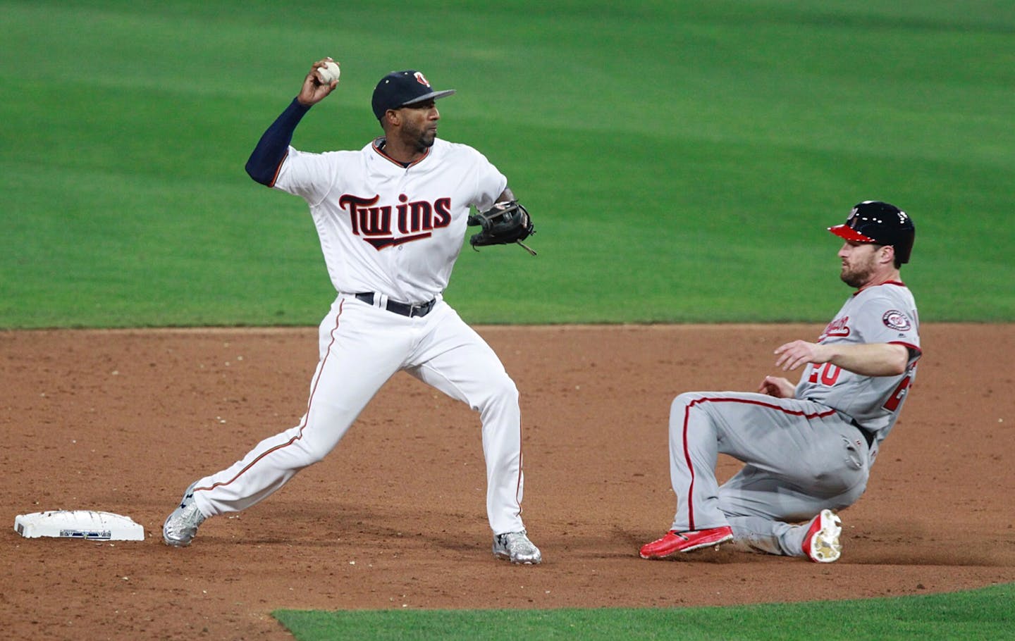 Minnesota Twins second baseman Eduardo Nunez, left, throws to first base to complete a double play after forcing out the Washington Nationals' Daniel Murphy in the ninth inning during the All-Star Game at Petco Park in San Diego on Tuesday, July 12, 2016. (Hayne Palmour IV/San Diego Union-Tribune/TNS) ORG XMIT: 1187235