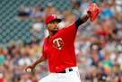 Minnesota Twins starting pitcher Ervin Santana throws to the New York Yankees in the first inning of a baseball game Friday, July 21, 2017, in Minneap