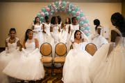 Debutantes prepared to have their group photo taken a few hours before the start of Saturday's winter cotillion.