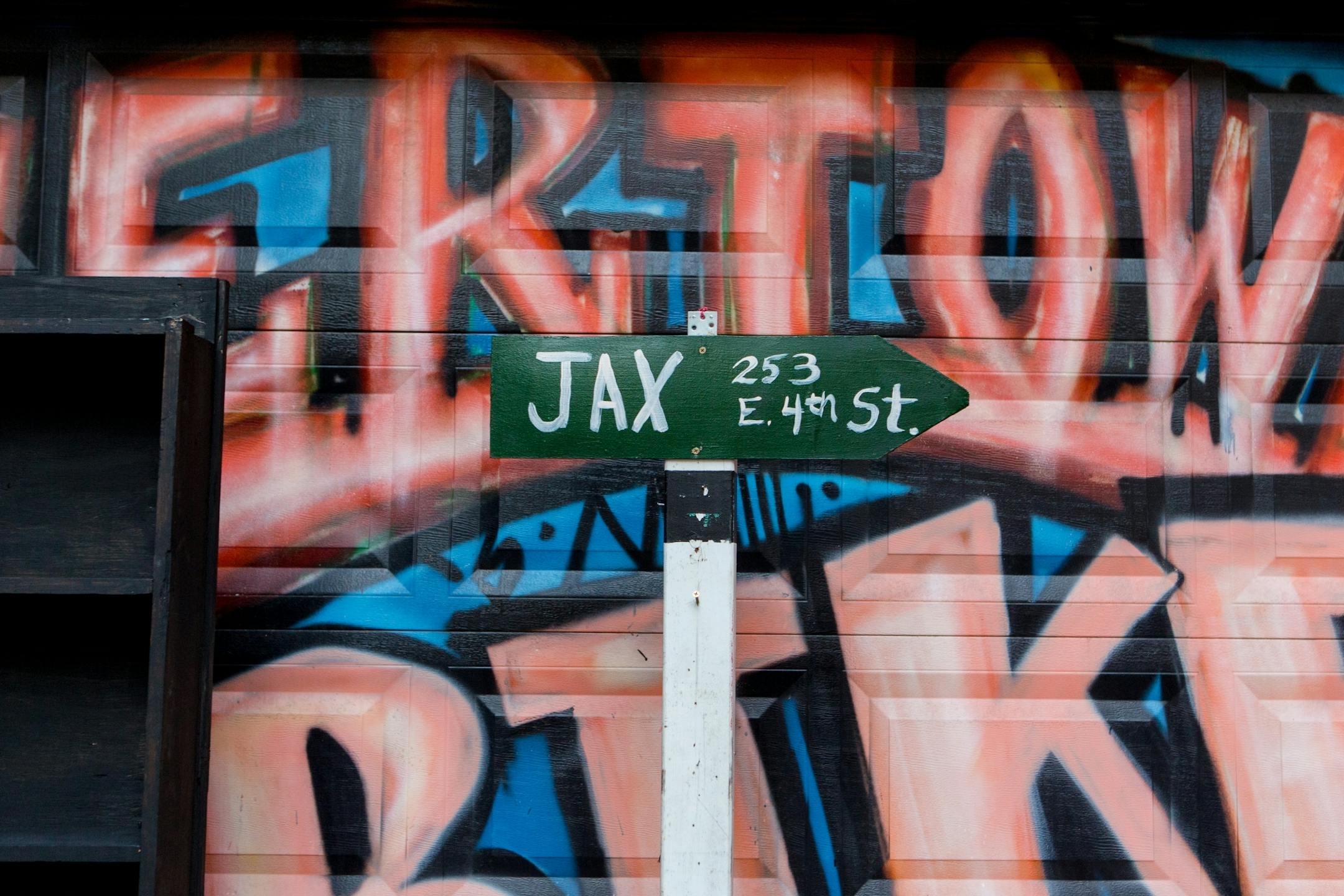 A sign to honor the Jax building stands in the alley of the Jax Building Friday evening.
