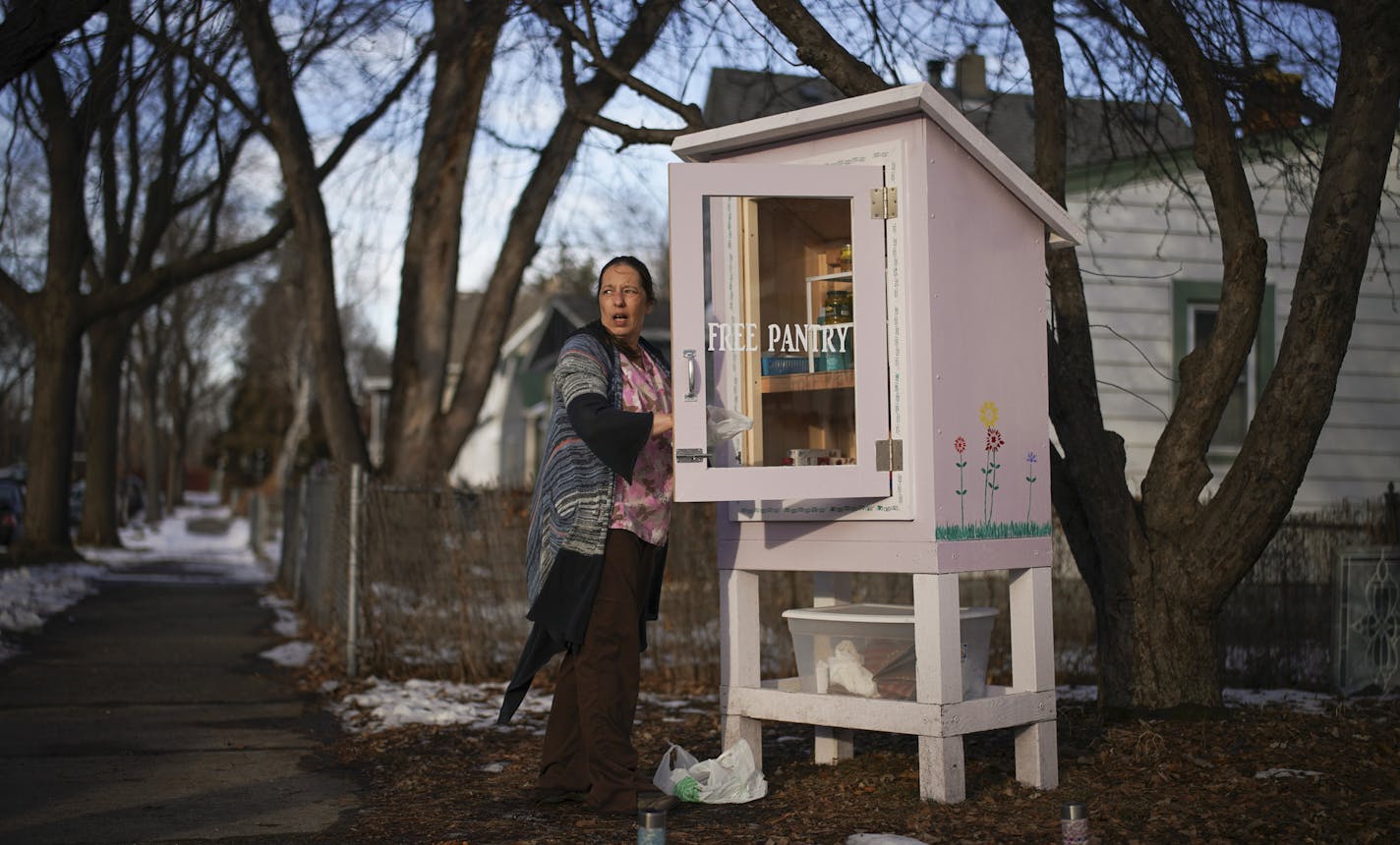 After she got home from work, Jamie Hendricks restocked the shelves of the Little Free Pantry she maintains in front of her home in St. Paul's North End. ] JEFF WHEELER &#x2022; jeff.wheeler@startribune.com In the North End of St. Paul Jamie Hendricks has started a "Little Free Pantry" - like the ubiquitous "Little Free Library" but for food and household goods like toothpaste and diapers. It's an informal neighborhood effort, stocked by the Hendricks and anyone else who'd like to contribute, wi