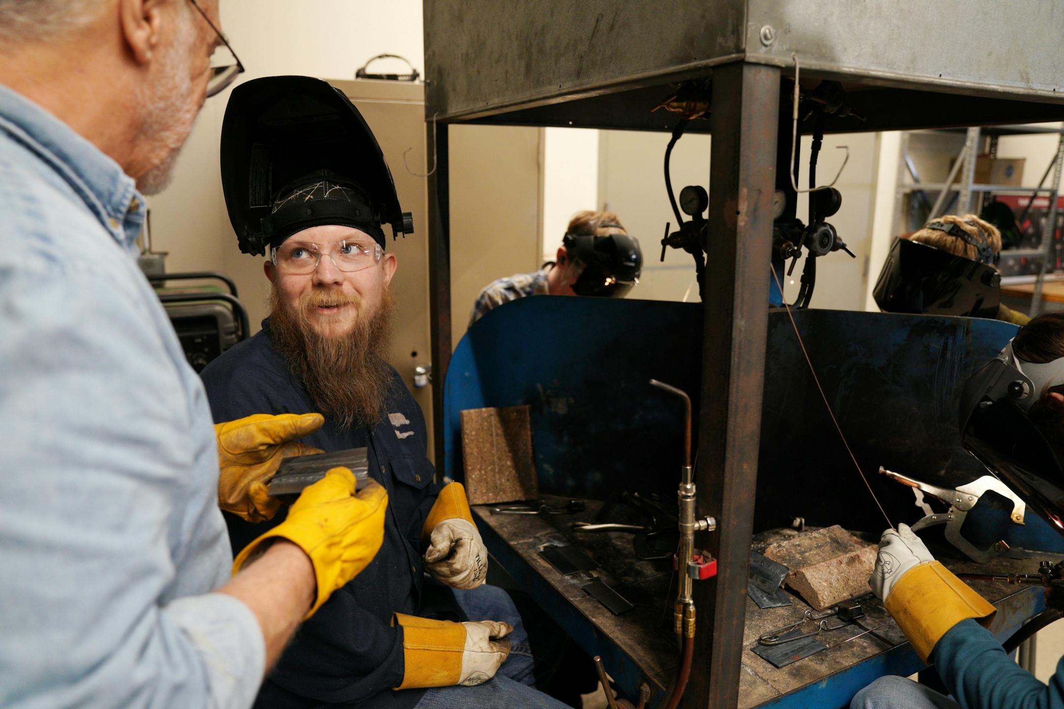 Welding instructor Mike Ford gave some direction to Shaun Hazeman of Red Wing as he practiced his welds.
