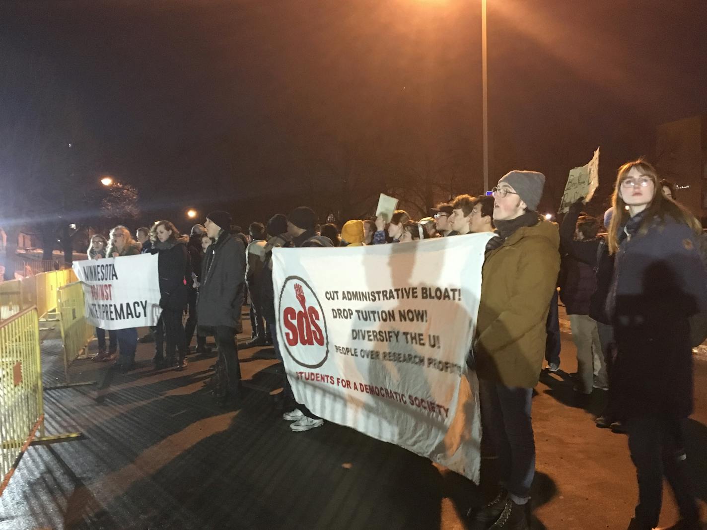 Dozens of protesters shouted and held signs outside the University of Minnesota building where conservative commentator Ben Shapiro is speaking Monday night.