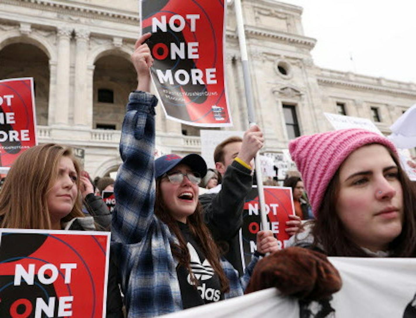 Students holding signs protesting gun violence, including Andrea Thompson, 16, of White Bear Lake gathered Saturday at the State Capitol for a rally.