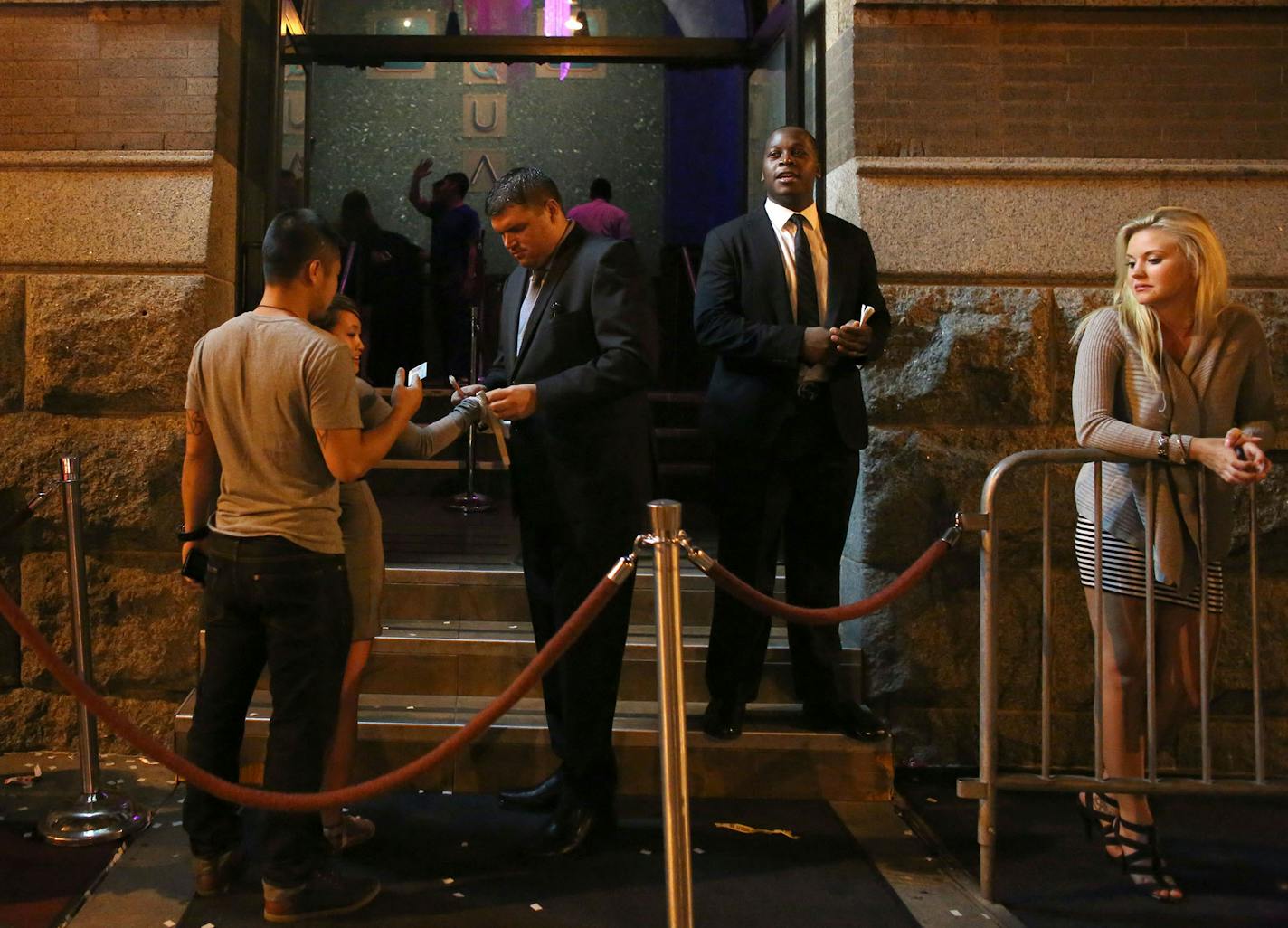 Security checked IDs at the front door of the night club Aqua a couple of hours before the bar close. ] (KYNDELL HARKNESS/STAR TRIBUNE) kyndell.harkness@startribune.com in Minneapolis Min. Friday, August, 15, 2014. ORG XMIT: MIN1408151422376422