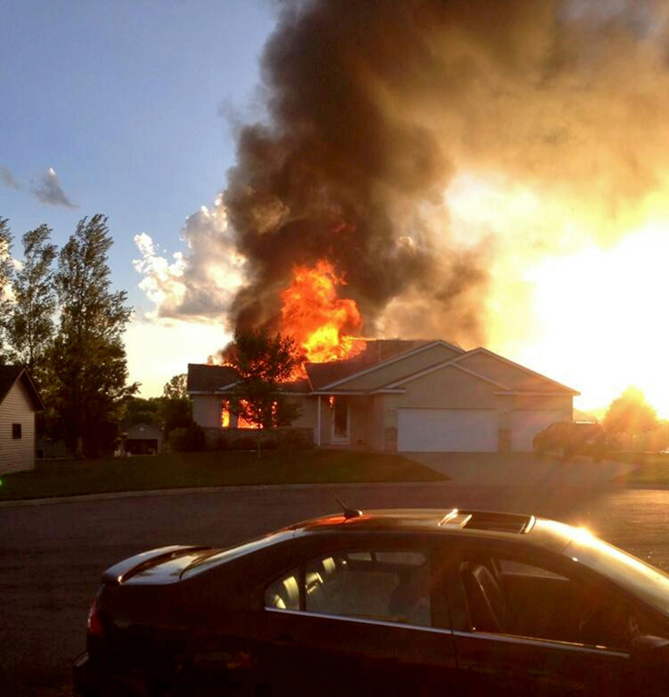 A plane crashed into a house in Sauk Rapids, MN setting it afire.