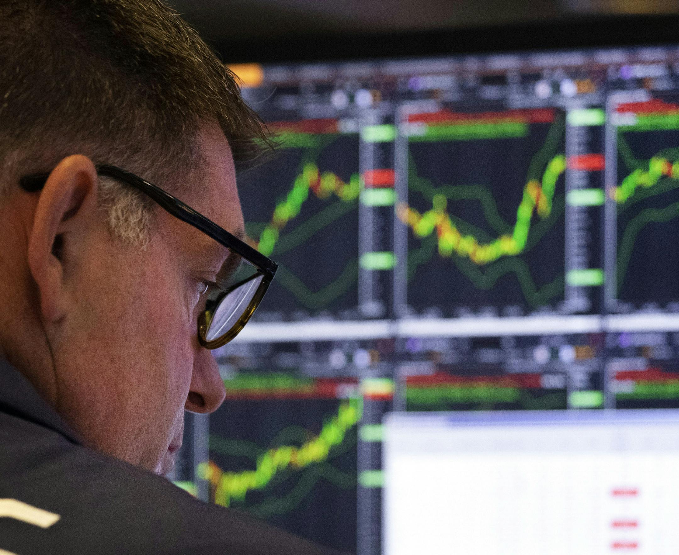 FILE - In this Friday, July 5, 2019, photo a trader works at the New York Stock Exchange in New York. Profits surged for U.S. businesses last year, with growth topping 20% for S&P 500 companies in much of 2018. But the gusher got capped at the start of 2019, and analysts say the sputtering out may last most of this year, as the tax-cut jolt wears off and worries about the trade war linger. (AP Photo/Mark Lennihan, File) ORG XMIT: NYBZ462