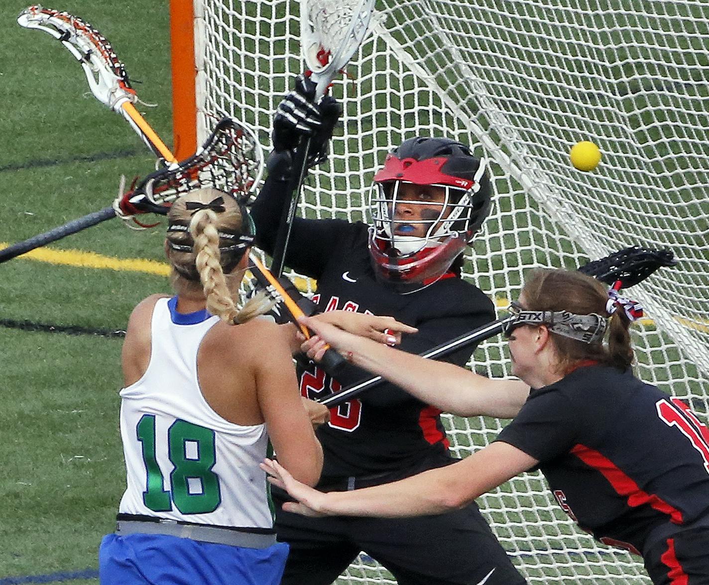 Blake's Lydia Sutton (18) scored a first half goal beating Eden Prairie goalie ASsil Asfour on the play. ] Girls lacrosse championship game - Eden Prairie vs. Blake . (MARLIN LEVISON/STARTRIBUNE(mlevison@startribune.com)