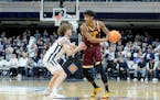 Gophers guard Cam Christie, right, looks to keep the ball away from Butler in the first round of the NIT on Tuesday at Hinkle Fieldhouse in Indianapol