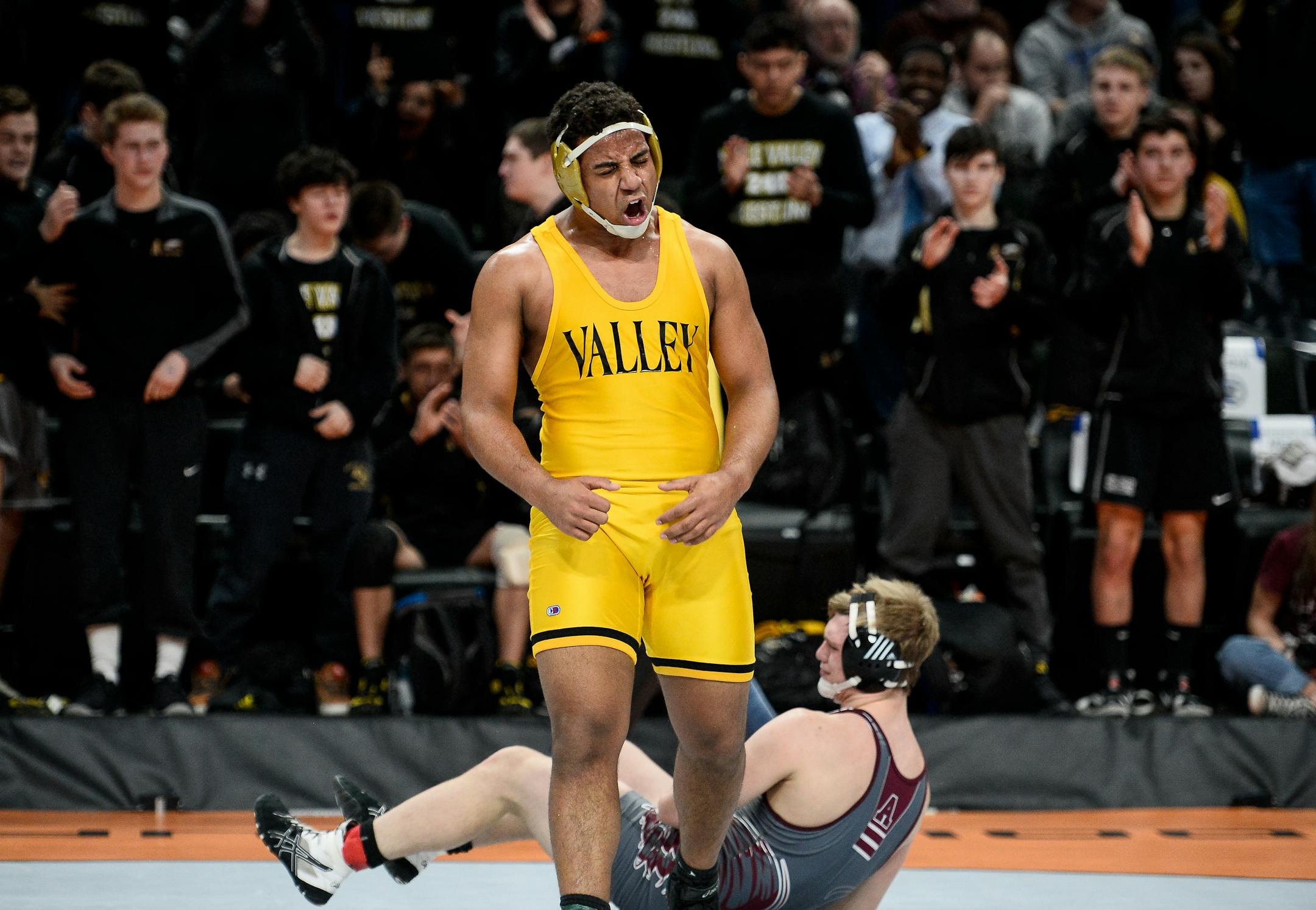 Apple Valley's Tanyi Besong defeated Evan DeChene in the 220-pound weight class Thursday night.